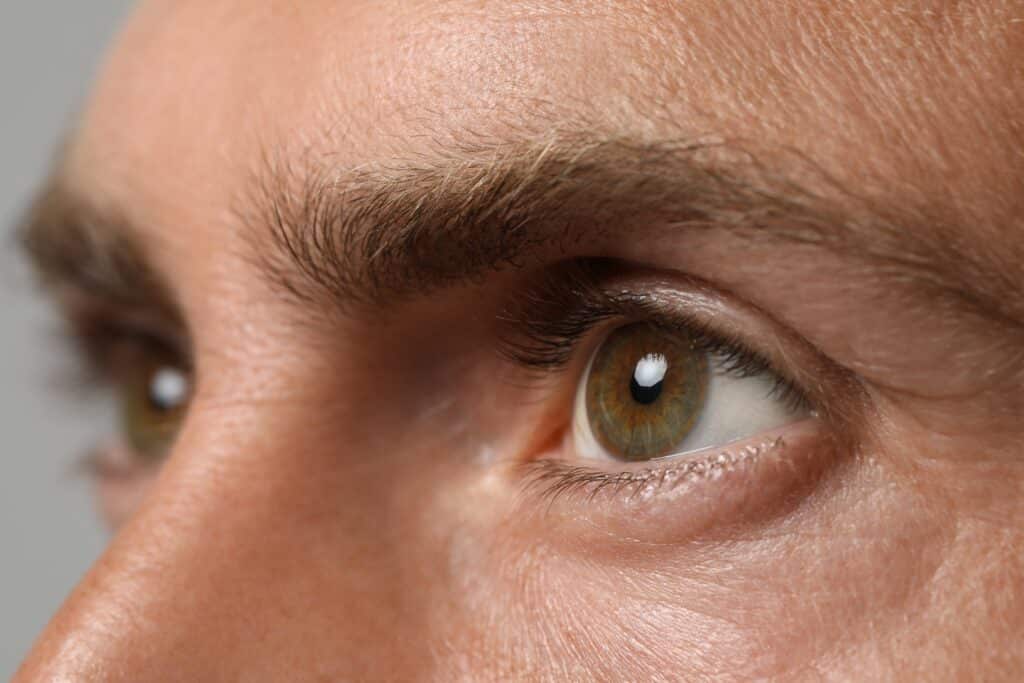 Close up of a man's eyes, perhaps in need of a blepharoplasty to improve his eyelids