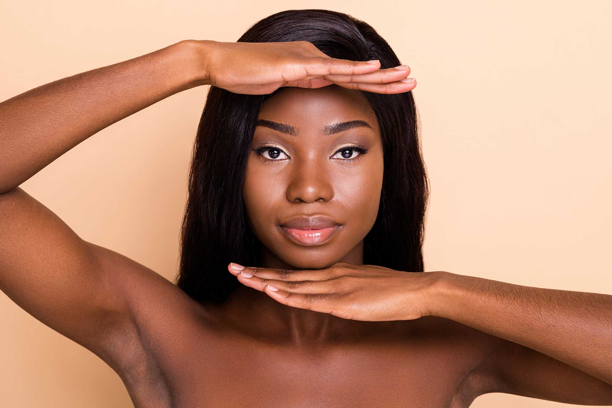 Woman with hands framing face