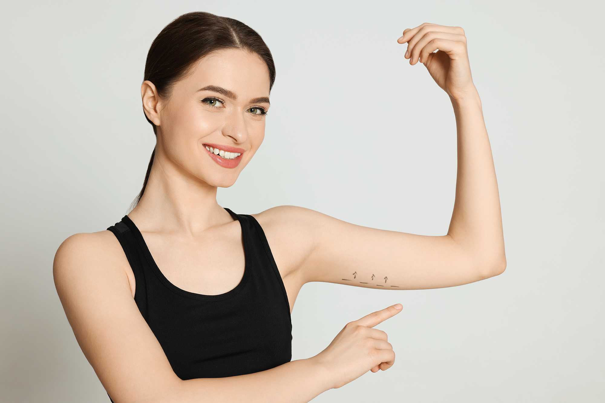 Woman shows muscular arm